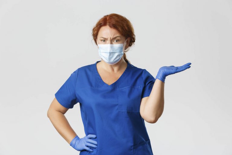 female dental worker with mask and gloves on