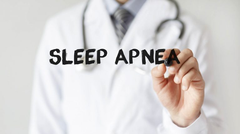 Doctor writing word Sleep Apnea with marker
